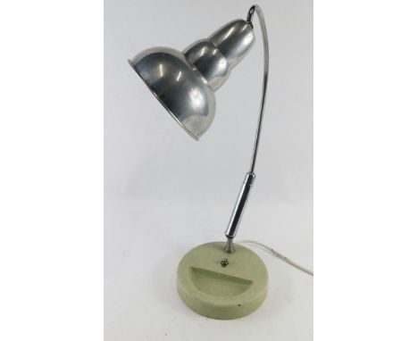 A vintage chrome and metal table lamp, with cone shade, articulated arched stem and circular foot with recess, with electrica