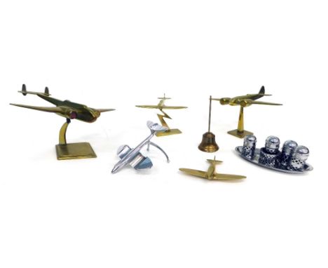 A brass model of a Spitfire, on lightening strike stand, 13cm high, another Spitfire model, lacking stand and two brass model