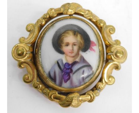 A 20thC portrait pendant brooch, centred with an enamelled style portrait of a child, 3cm x 3cm, in a scroll surround, with a
