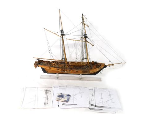 A scale model of a ship, with realistic rigging and deck, on stand, with kit making instructions, 77cm high. 