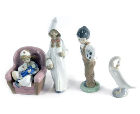 Various Lladro and Nao figures, boy holding football 18cm high, girl nurse, Lladro figure of a girl in flowing robes and a go
