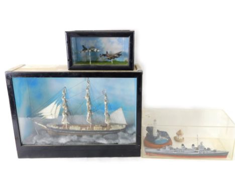 A cased model of a ship, with realistic deck and rigging, in glass fronted case, 34cm high, 49cm wide, 17cm deep, a cased pai