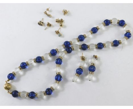 Three pairs of 9ct gold stud earrings, comprising two stone set, one with aquamarine the other ruby and sapphire, and a neckl
