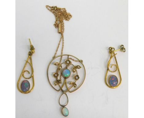 A matched Art Nouveau jewellery set, comprising floral and garland drop pendant, set with opal, 4cm high, and two club shaped