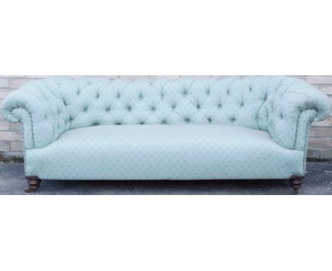 A Victorian Chesterfield sofa, with green patterned upholstery, and turned walnut legs, 200cm wide. 