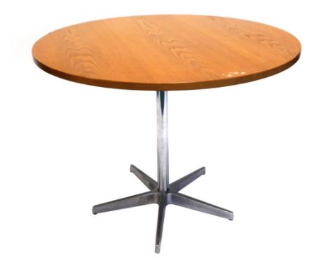 A vintage light oak circular top dining table, on a chrome stem terminating in spoke feet, 75cm high, 101cm diameter.