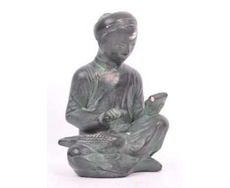 A 20th century circa. 1960s Austin bronzed plaster sculpture modelled in the form of a seated Chinese figure with abacus rest