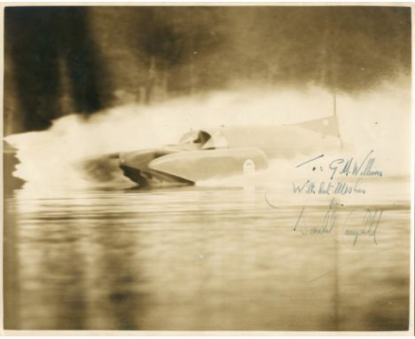 CAMPBELL (DONALD MALCOLM)Photograph depicting Bluebird K7 at speed, signed and inscribed in ink ('To: G.M. Williams/ With bes