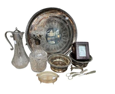 A silver mounted three spout decanter, a silver mounted butter dish, a pair of plated coasters, a circular tray, a carriage c