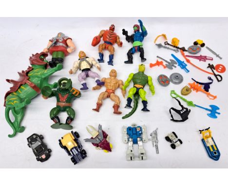Mattel Masters of the Universe loose figures and accessories & Hasbro Takara Transformers in mixed lot. Poor to fair.Figures 