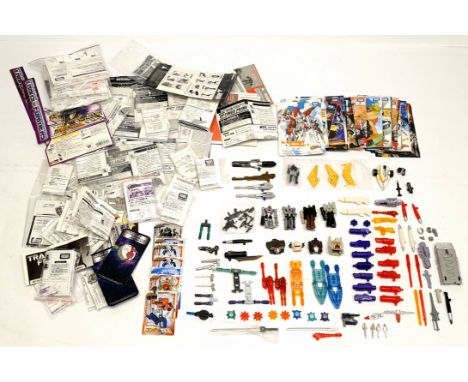 Quantity of Transformers related loose weapons, accessories, parts and instruction sheets, unchecked for completeness and cor