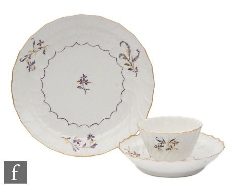 A Worcester Flight, Barr and Barr period tea bowl, saucer and matched plate circa 1783-88 spirally fluted, decorated with puc