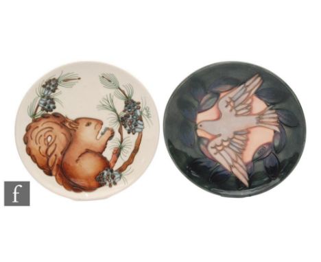 Two Moorcroft Pottery wall Year plates, the first for 1995 and decorated with a squirrel, the second for 1993, tubelined with