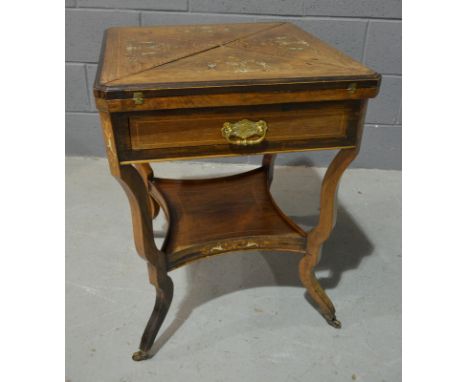 A late 19th to early 20th Century envelope top card table, with foliate inlaid ivory and satinwood detail, the top with cante