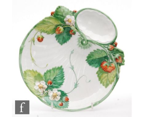 A late 19th Century Minton strawberry dish of fluted shell form relief moulded with flowering and fruiting strawberry plants 