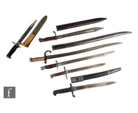 A German Mauser bayonet and scabbard marked Waffenfabrik, 37cm blade, a French Socket bayonet and four other bayonets. (6) 