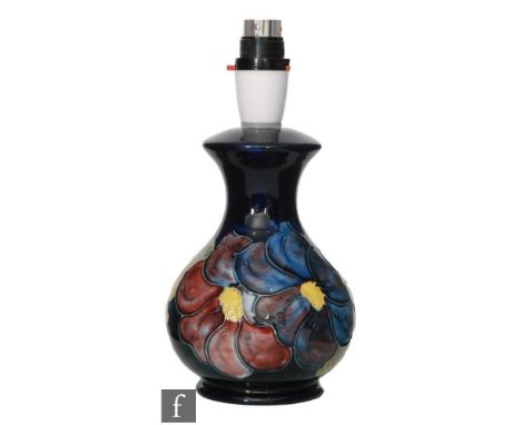 A Moorcroft table lamp decorated in the Clematis pattern, impressed mark, height 16cm, excluding fittings. 