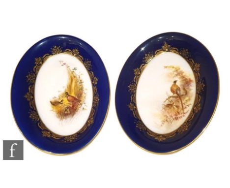 A pair of early 20th Century Royal Worcester oval dishes, each had painted to the central well with a scene of Pheasants and 