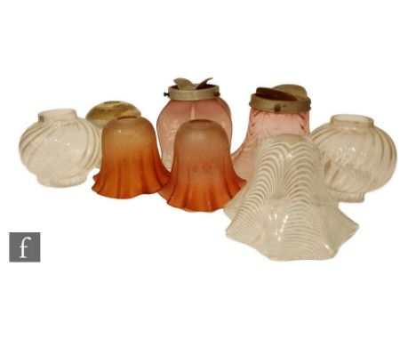 A collection of eight late 19th to early 20th Century oil lamp shades of various forms, to include ruby, pulled loop and othe