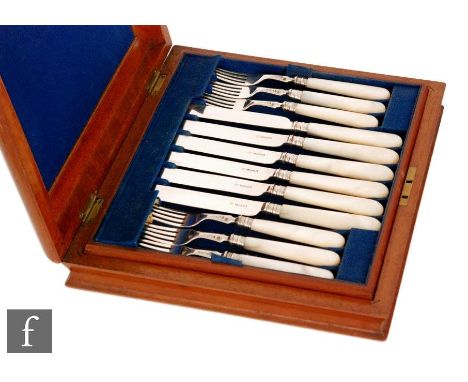A matched set of twelve Victorian hallmarked silver and mother of pearl knives and forks, Sheffield 1877 &amp; 1882, Henry Wi