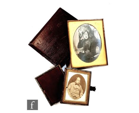 A 19th Century ambrotype photograph of a seated gentleman in thinking pose and another of a gentleman, both in leather cases.