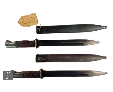 A pair of Mauser Alex Coppel German bayonets with steel scabbards, one numbered F17289 and the scabbard F32 and the other num