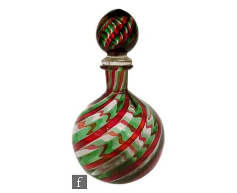 A 20th Century Murano glass scent bottle of globe form with collar neck, decorated with a spiral trail of green and red again