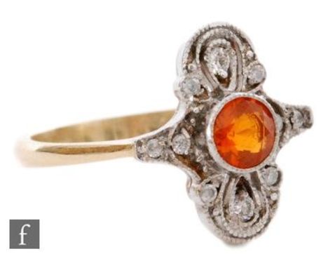 An 18ct hallmarked Edwardian style fire opal and diamond dress ring, central collar set opal to a cushion oval diamond pace s