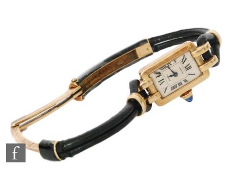 A lady's 18ct Cartier wrist watch, Roman numerals to a rectangular dial with sapphire set button, to a split black leather de