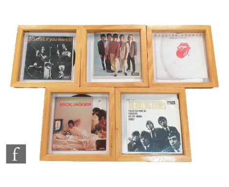 A collection of framed Rolling Stones EPs, including The Rolling Stones DFE8560, Mono, Mick Jagger A4722, Undercover of the N