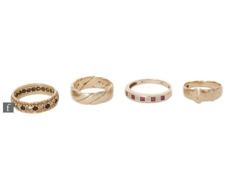 Four 9ct hallmarked rings a wedding ring, a signet ring, a garnet and paste full eternity and a ruby and paste half eternity 