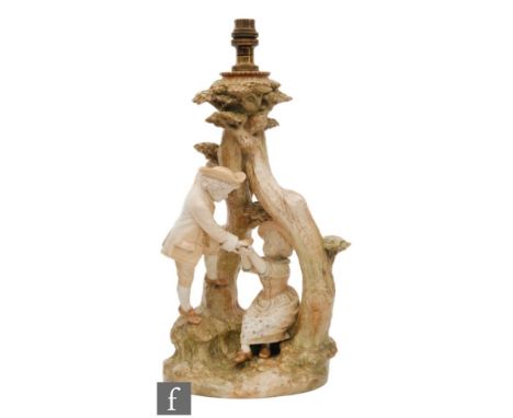 A large Royal Worcester blush ivory table lamp, shape 1240, modelled as a young boy offering a basket to a seated girl, sat w