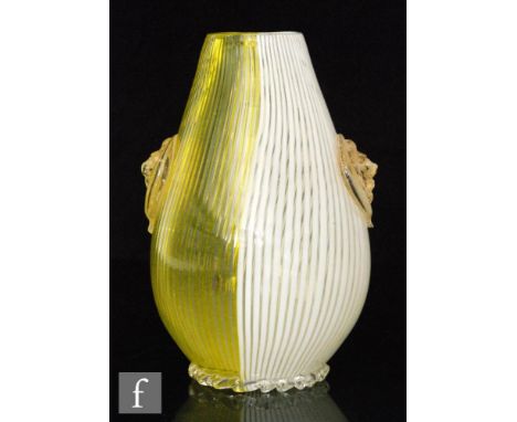 An Italian post war Venetian Murano glass vase of ovoid form with vertical yellow and white fine lines, over decorated with a