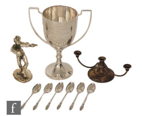 A hallmarked silver twin handled trophy cup with presentation engraving with a set of six silver apostle spoons, a squat thre