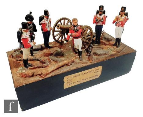 A light infantry 1808 diorama of six lead soldiers with canon on a naturalistic base representing the 52nd, 68th, 95th, 85th 