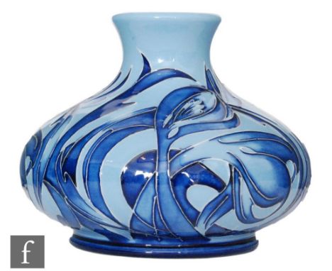 A Moorcroft Pottery Design Trial vase of compressed form decorated in a blue on blue stylised foliate design with swirled lea