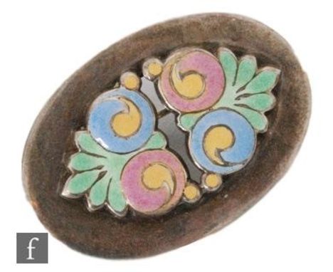 A silver oval brooch with central enamel decorated floral panel to a plain border, length 3cm, stamped Silver B.I to reverse,