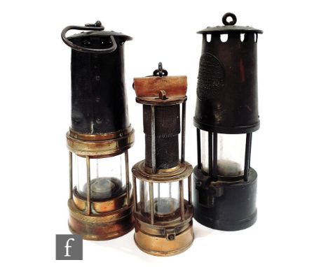 A small early brass miners lamp by John Mills Newcastle on Tyne, height 19cm, a Protector miners lamp and a Hills Plymouth mi