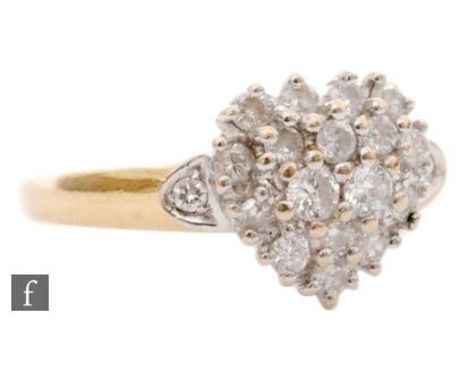 An 18ct hallmarked diamond cluster ring, heart shaped pave set head to diamond set shoulder, ring size I 1/2. 