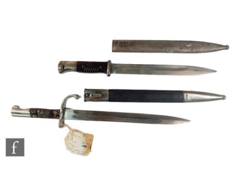 A 1940 German Mauser bayonet and scabbard stamped Coppel GMBH and another Mauser bayonet and scabbard. (2) 