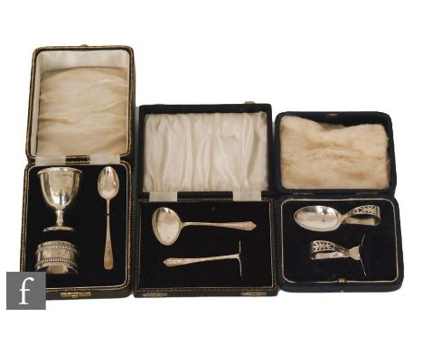 Two cased hallmarked silver children's feeding sets with pusher and spoon, Sheffield 1928 and Birmingham 1960, together with 