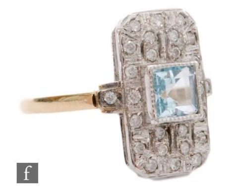 An 18ct hallmarked Art Deco style aquamarine and diamond cluster ring, central collar set square cut aquamarine to a canted p