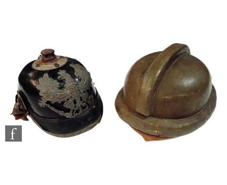 A World War One Prussian helmet with original lining and a green paratrooper's training helmet, S/D (2)