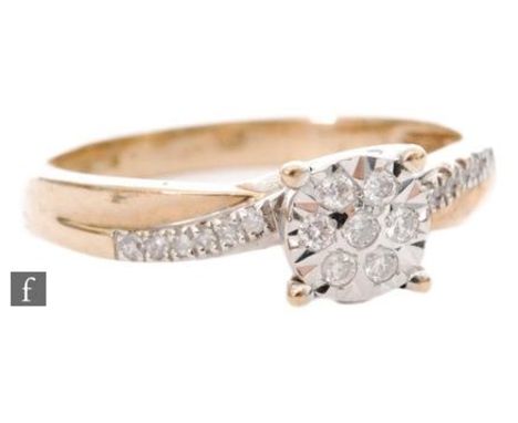 A 9ct diamond cluster ring, circular head detailed with seven sunk set diamonds to diamond set shoulders, weight of ring 2.8g