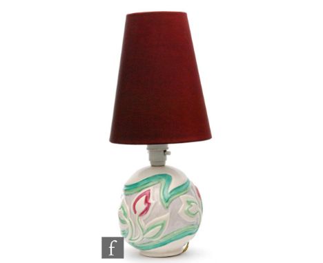 A Clarice Cliff Scraffito table lamp circa 1936 of spherical form, relief moulded with stylised flowers and foliage picked ou