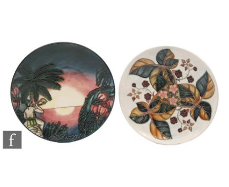 Two Moorcroft Pottery wall plates, the first decorated in the Birth of Light 'Millennium' pattern designed by Nicola Slaney, 