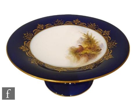 An early 20th Century Royal Worcester comport with splayed foot, knopped stem and shallow dish form top, hand painted by W. H