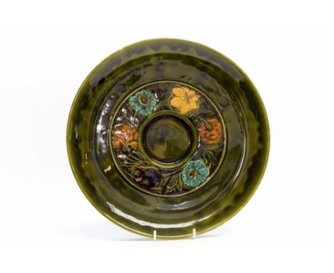 Christopher Dresser for Linthorpe, an art pottery, Aesthetic Movement plate, majolica glazed relief design with a central wre