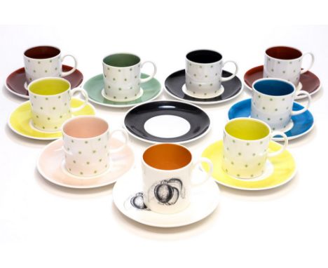 Susie Cooper, a harlequin set of 1950s coffee cans and saucers, star pattern to the exteriors, coloured to the inside and the