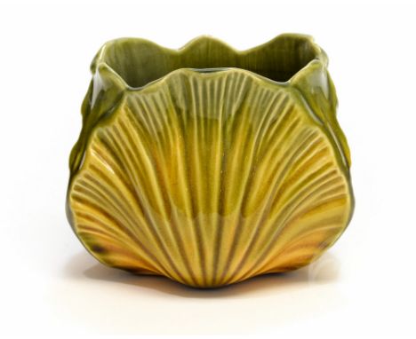 Christopher Dresser for Ault, a majolica jardiniere, circa 1880, of scallop leaf design, glazed in green draining to yellow, 
